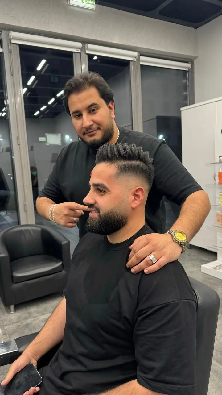 Applying beard oil at OSA Gents Salon, Dubai