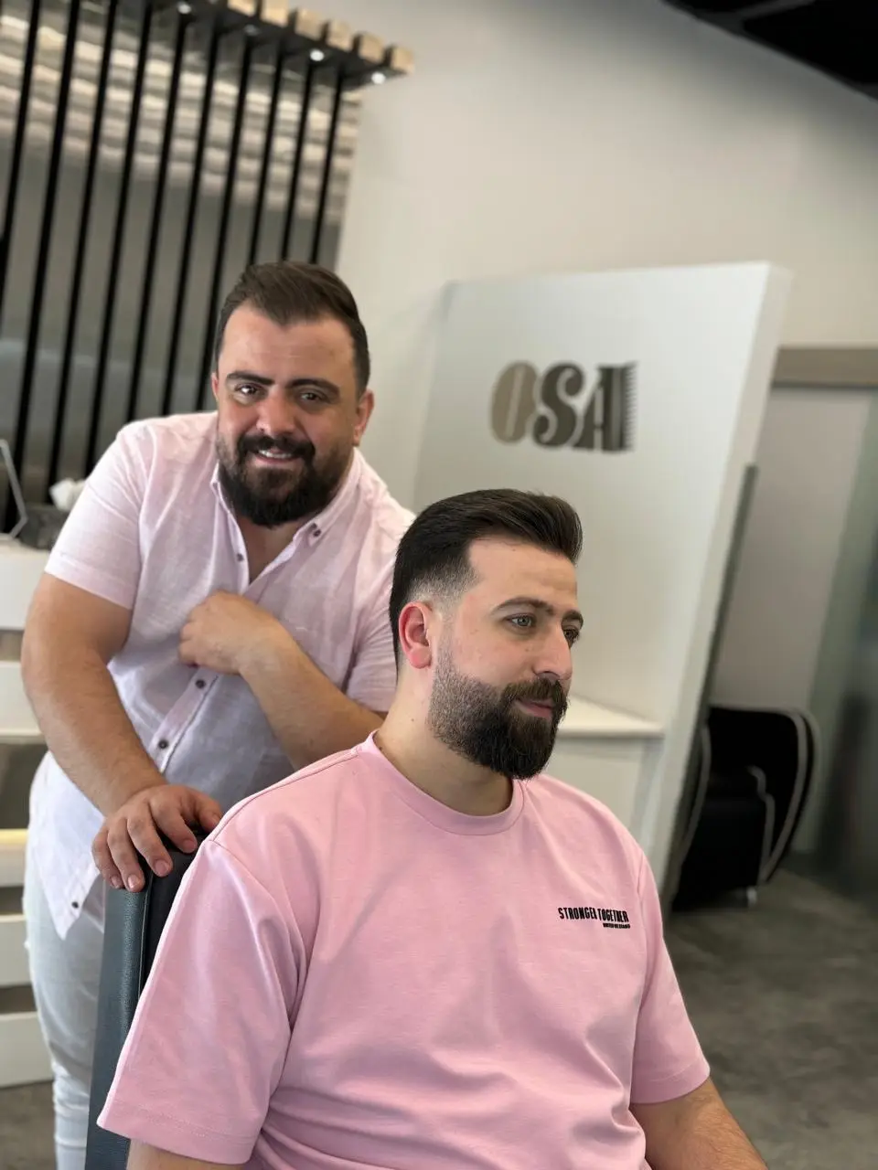 Master barber styling a client's fresh haircut and beard at OSA Gents Salon, Jumeirah Dubai