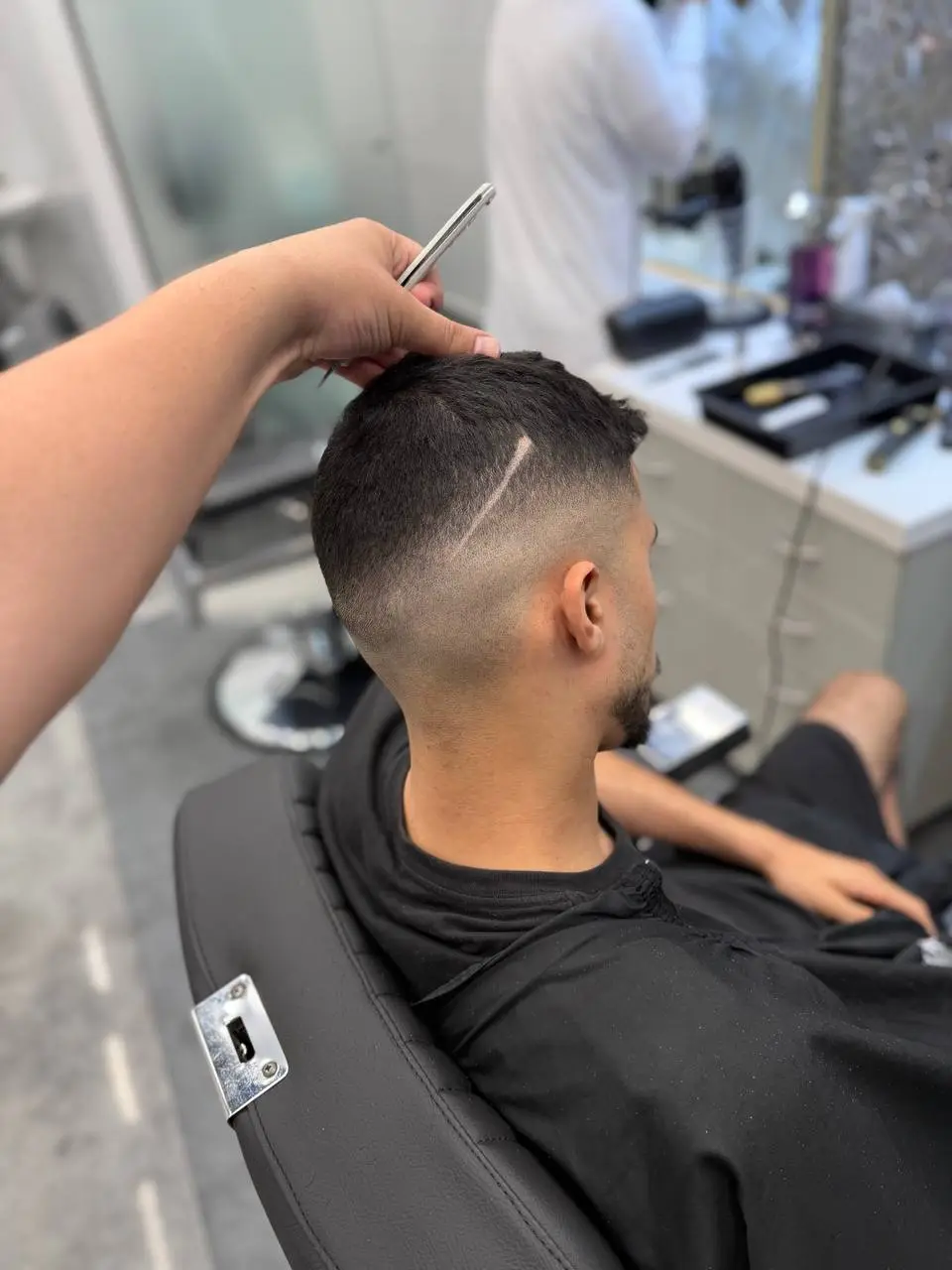 Barber at work in the chair at OSA Gents Salon, Jumeirah Dubai