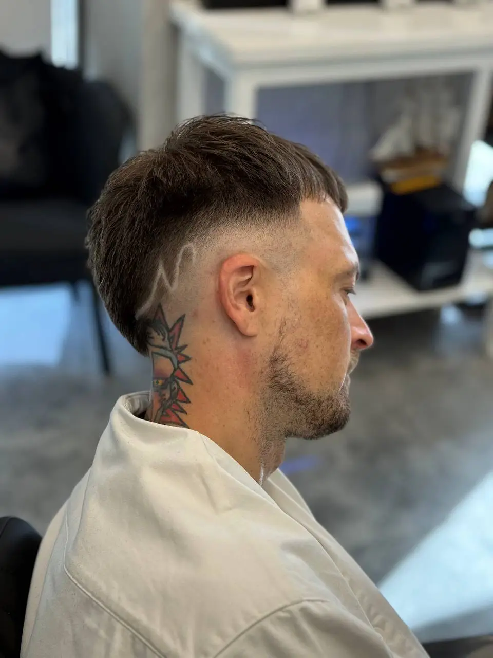 Mid fade with a crisp line-up at OSA Gents Salon, Jumeirah Dubai