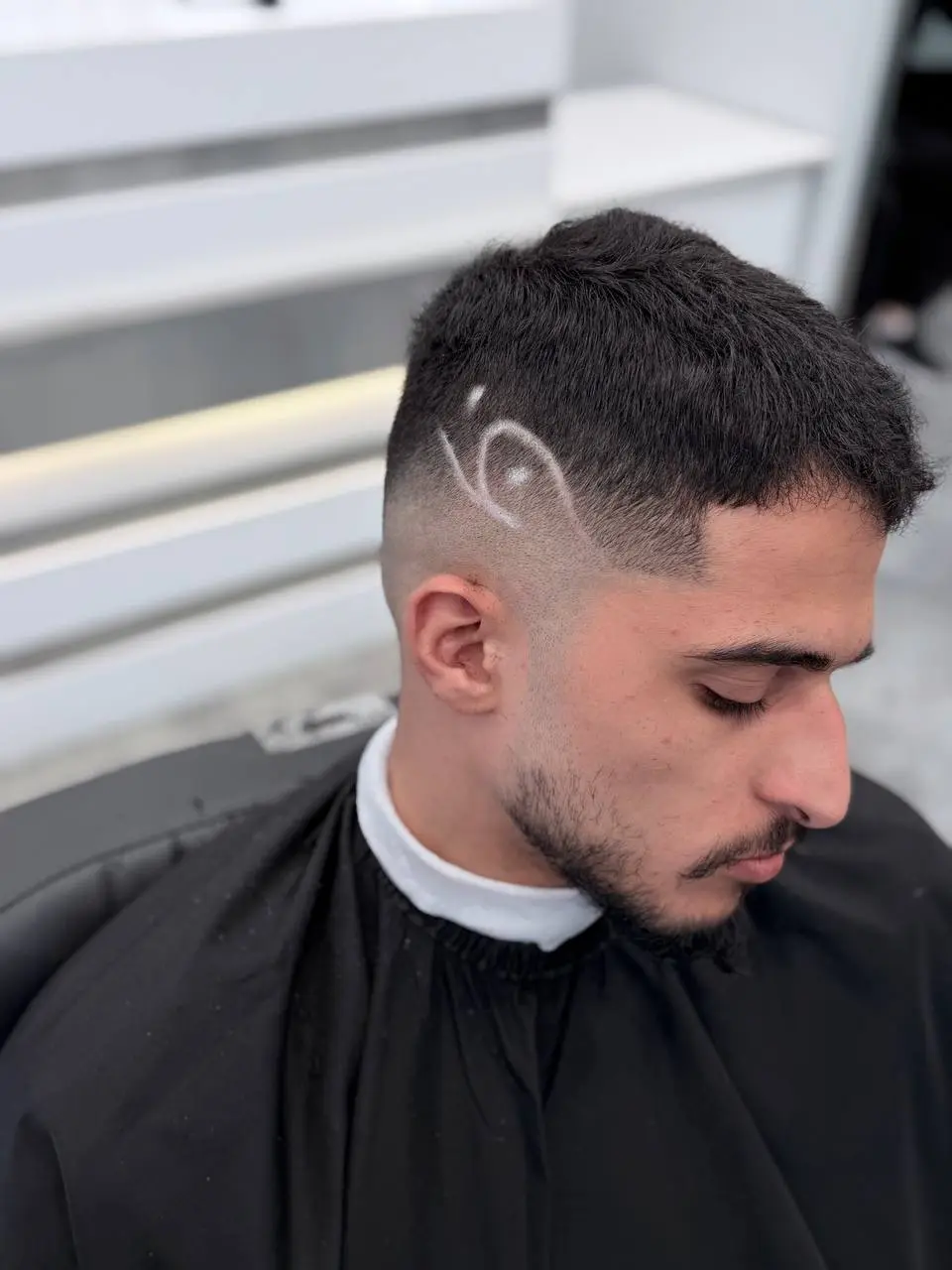 Skin fade with a hair design line at OSA Gents Salon, Dubai